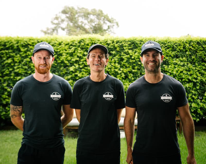 Our Pest2Kill team Pest2Kill Sydney Pest Control workers posing for a photo in the front yard.