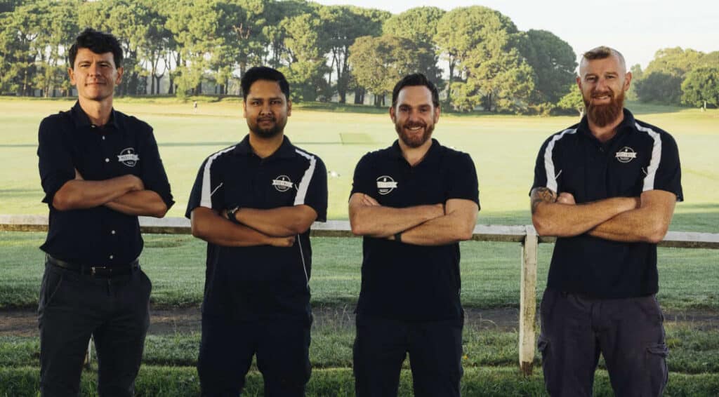 Four workers from Pest2Kill pest control company, posing with arms crossed.